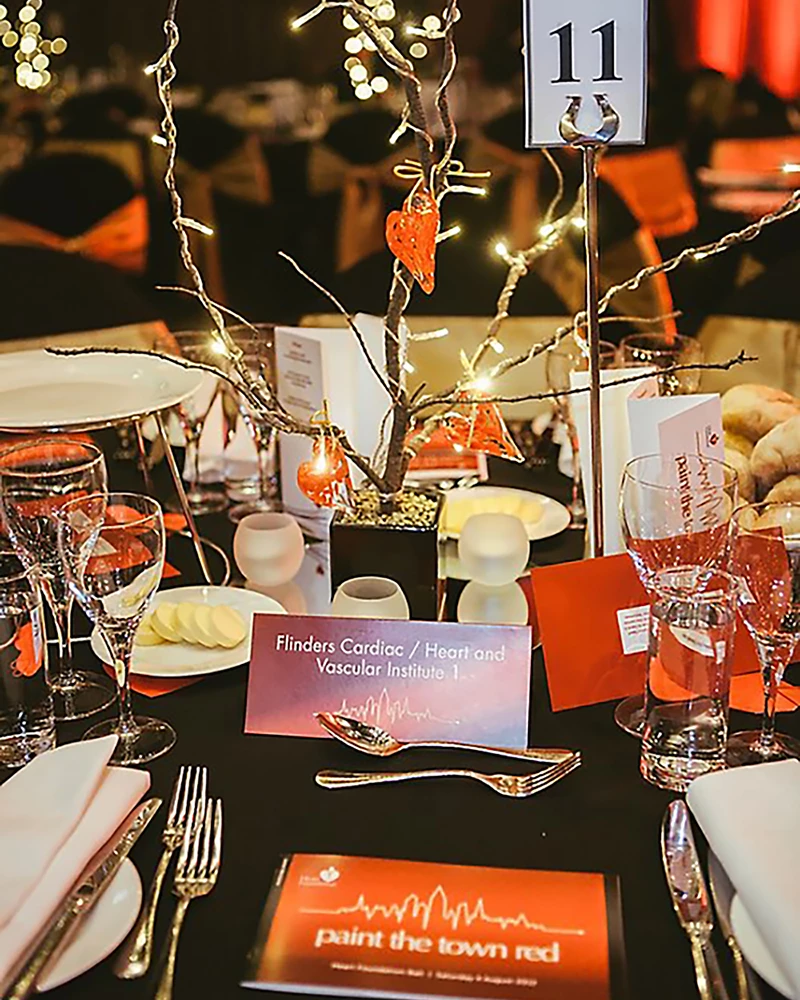 Paint the Town Red table closeup, of the placecards and DL landscape.